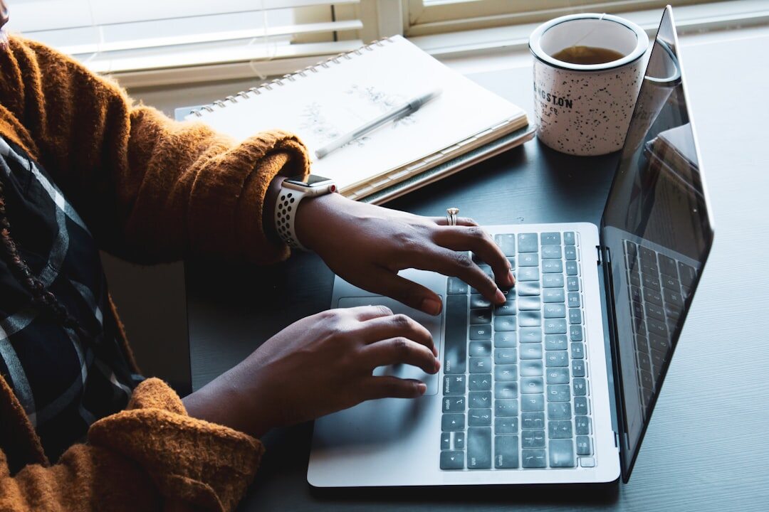 blogger typing on computer